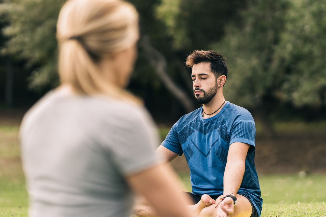 learner-and-instructor-doing-yoga-in-a-park learner-and-instructor-doing-yoga-in-a-park