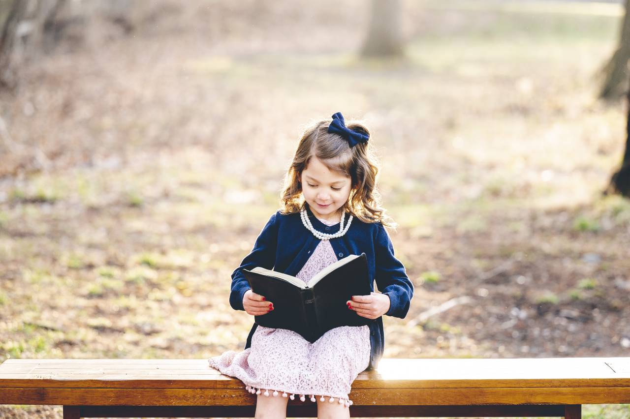 little-caucasian-christian-girl-reading-the-holy